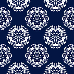 Floral seamless pattern. White flowers on dark blue background