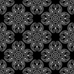  White geometric pattern on black. Seamless background. Indian style