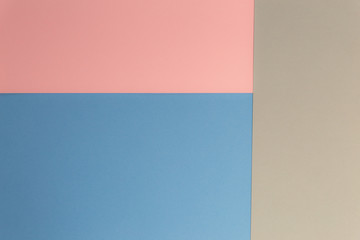 Fototapeta premium Multicolor background from cardboard of different colors. Pastel paper color for background. Colorful abstract geometric shapes. Pastel colored paper texture minimalism background. Pink, Blue, Grey.