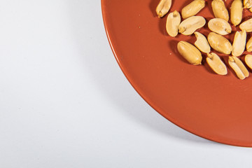 Nut in orange ceramic plate.