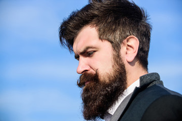 Fototapeta premium Making his beard perfect. Businessman against the sky. Bearded man. Future success. Male formal fashion. Mature hipster with beard. brutal caucasian hipster with moustache. Personal care. copy space