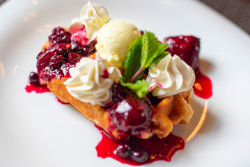 Belgian waffles with ice cream and berries