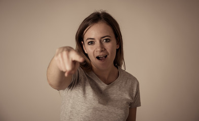 Mad and aggressive teen girl in facial expressions and negative human emotions