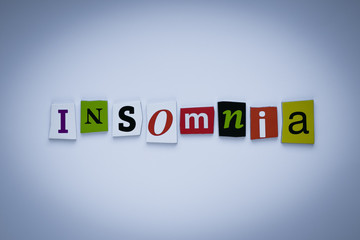 Word insomnia of cut letters. Headline - insomnia. A word writing text - insomnia. Banner with the inscription - insomnia.