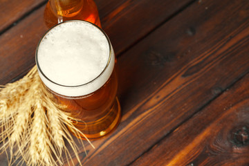 Glass beer on wood background