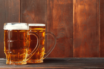 Glass beer on wood background