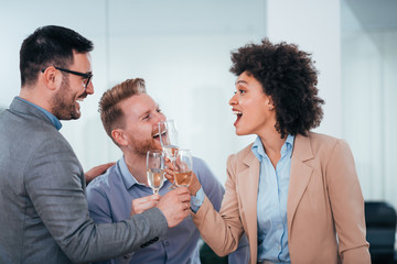 Happy business people toasting.