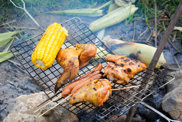 BBQ with fried chicken wings and corn