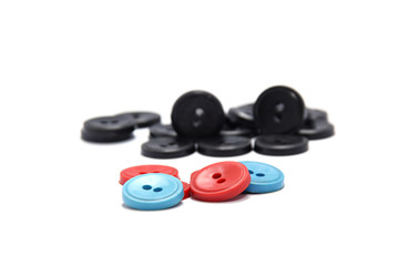Plastic buttons of different colors. buttons on a white background