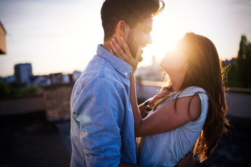 Beautiful couple in love dating outdoors and smiling