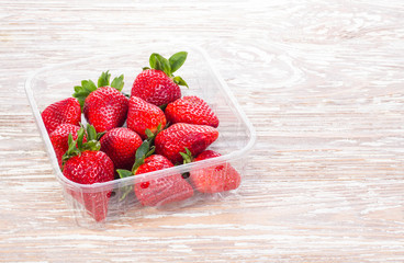 red strawberries group of berries in container
