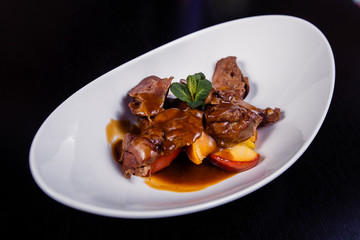 Duck liver with berry sauce and apples decorated with rosemary