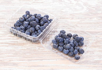blueberries in a container on table