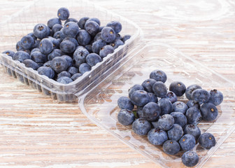 blueberries in a container on table