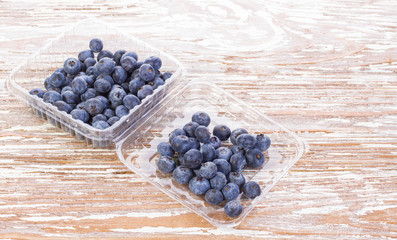 blueberries in a container on table