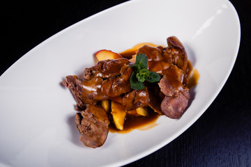 Duck liver with berry sauce and apples decorated with rosemary