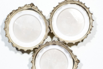 metal beer cap on white background.