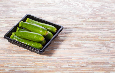 zucchini group of vegetables in plastic container