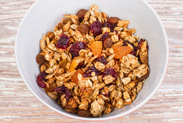 granola with cherry and raisins in plate