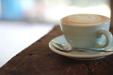cup of coffee on wooden table