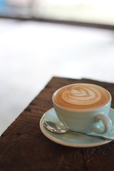 cup of coffee on wooden table