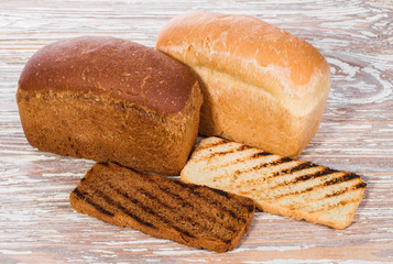 breads and toasts on a wooden background