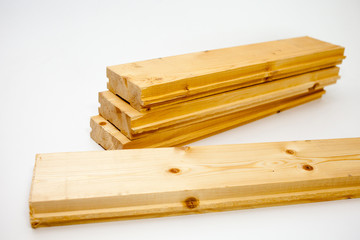 pile of pine boards for the floor device. Floor Board on white background. Decking