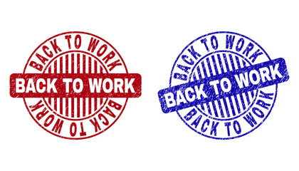 Grunge BACK TO WORK round stamp seals isolated on a white background. Round seals with distress texture in red and blue colors.