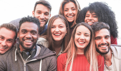 Happy millennial friends from diverse cultures and races taking selfie for social network story -...