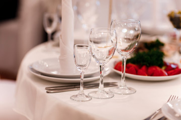 Glass glasses on the table. wine restaurant serving romance beautiful concept alcohol glass, holiday dinner in a cafe