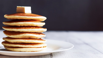 fresh classic pancake stacked in stack on gray background with place for text