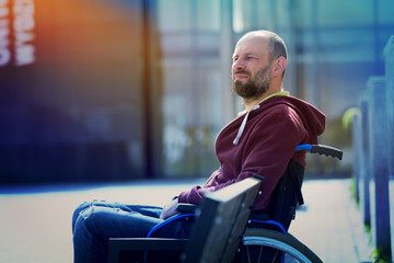 pensive man on wheelchair