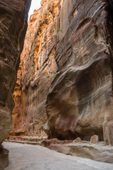 The Siq, the narrow slot-canyon that serves as the entrance passage to the hidden city of Petra, Jordan,