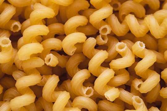 Top view of spiralli pasta. Macaroni texture for background