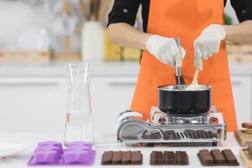Woman making chocolate