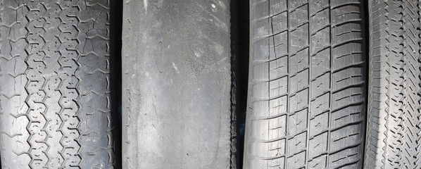 worn out bald old car tire close-up
