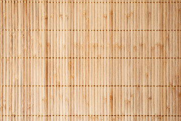 Bamboo mat,vertical..Bamboo sticks table mate binding with golden thread used for texture and background,top view.