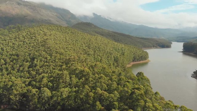 Aerial view beautiful nature with mountains and hills by Lake Mattupetty. Kerala State. Near the city of Munar.
