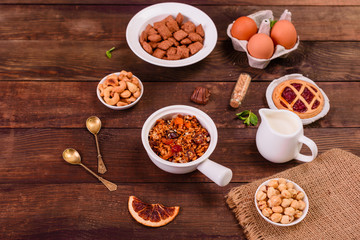 Tasty and useful breakfast with flakes, milk, nuts and dried fruits. The healthy food loading with energy