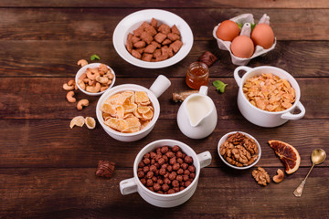 Tasty and useful breakfast with flakes, milk, nuts and dried fruits. The healthy food loading with energy