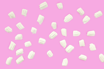 marshmallows for coffee on a pink background