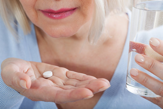 Pills on female hands cloce up. Suicide concept