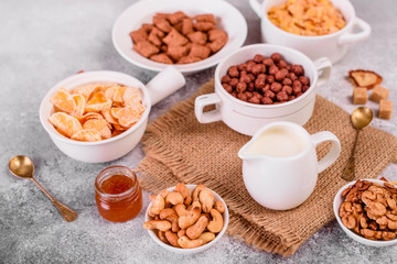 Tasty and useful breakfast with flakes, milk, nuts and dried fruits. The healthy food loading with energy