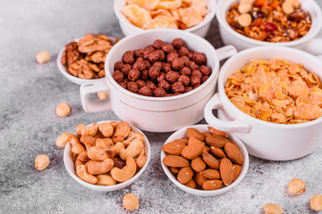 Tasty and useful breakfast with flakes, milk, nuts and dried fruits. The healthy food loading with energy