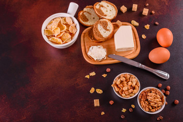 Tasty and useful breakfast with flakes, milk, nuts and dried fruits. The healthy food loading with energy