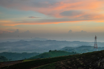 Golden sky with sea of mist in the morning and layer of mountain scene 