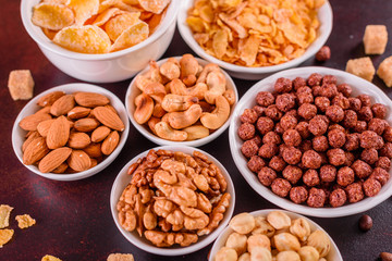 Tasty and useful breakfast with flakes, milk, nuts and dried fruits. The healthy food loading with energy