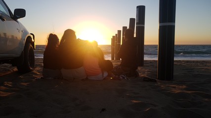 family sunset at beach