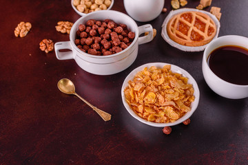 Tasty and useful breakfast with flakes, milk, nuts and dried fruits. The healthy food loading with energy