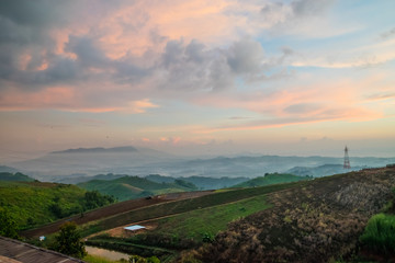 Fototapeta premium Golden sky with sea of mist in the morning and layer of mountain scene 